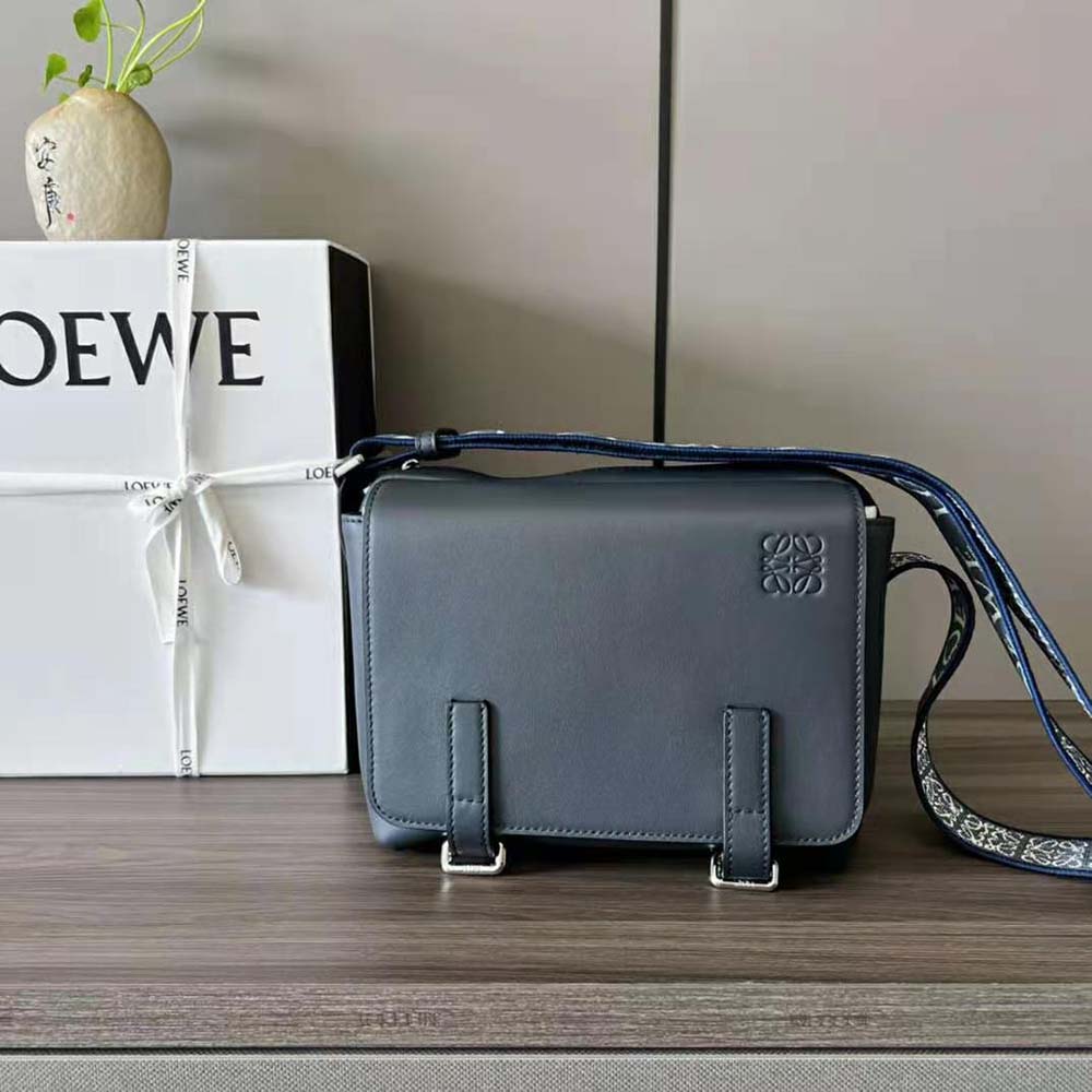 Close-up detail of jacquard fabric and matte hardware on Loewe messenger bag