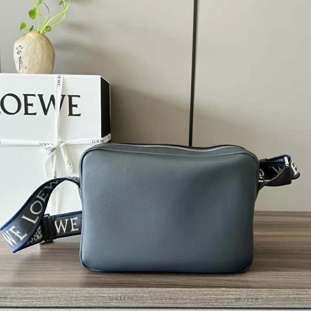 Side angle showing adjustable strap and compact silhouette of Loewe bag