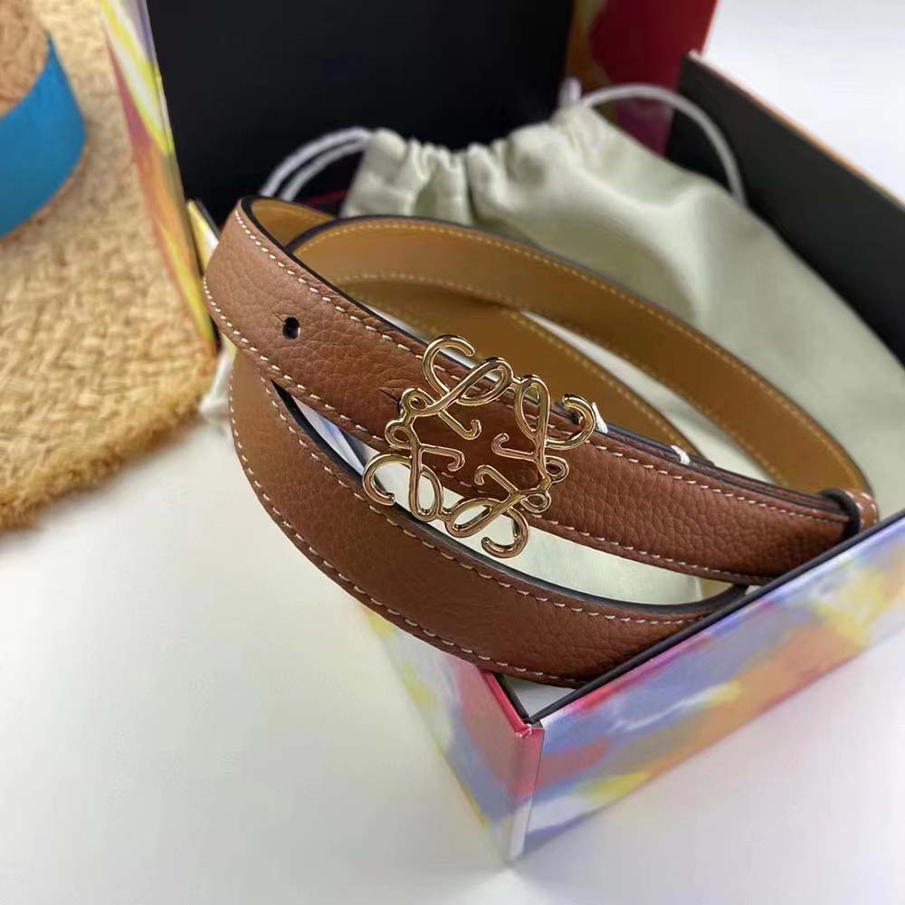 Close-up of brown pebble grain leather and Loewe Anagram buckle detail