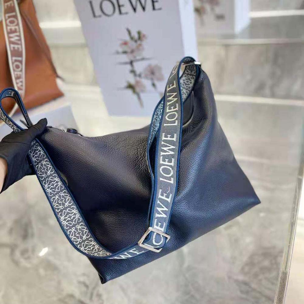 Close-up detail of silver-tone closure on Loewe Women Cubi Crossbody Bag navy