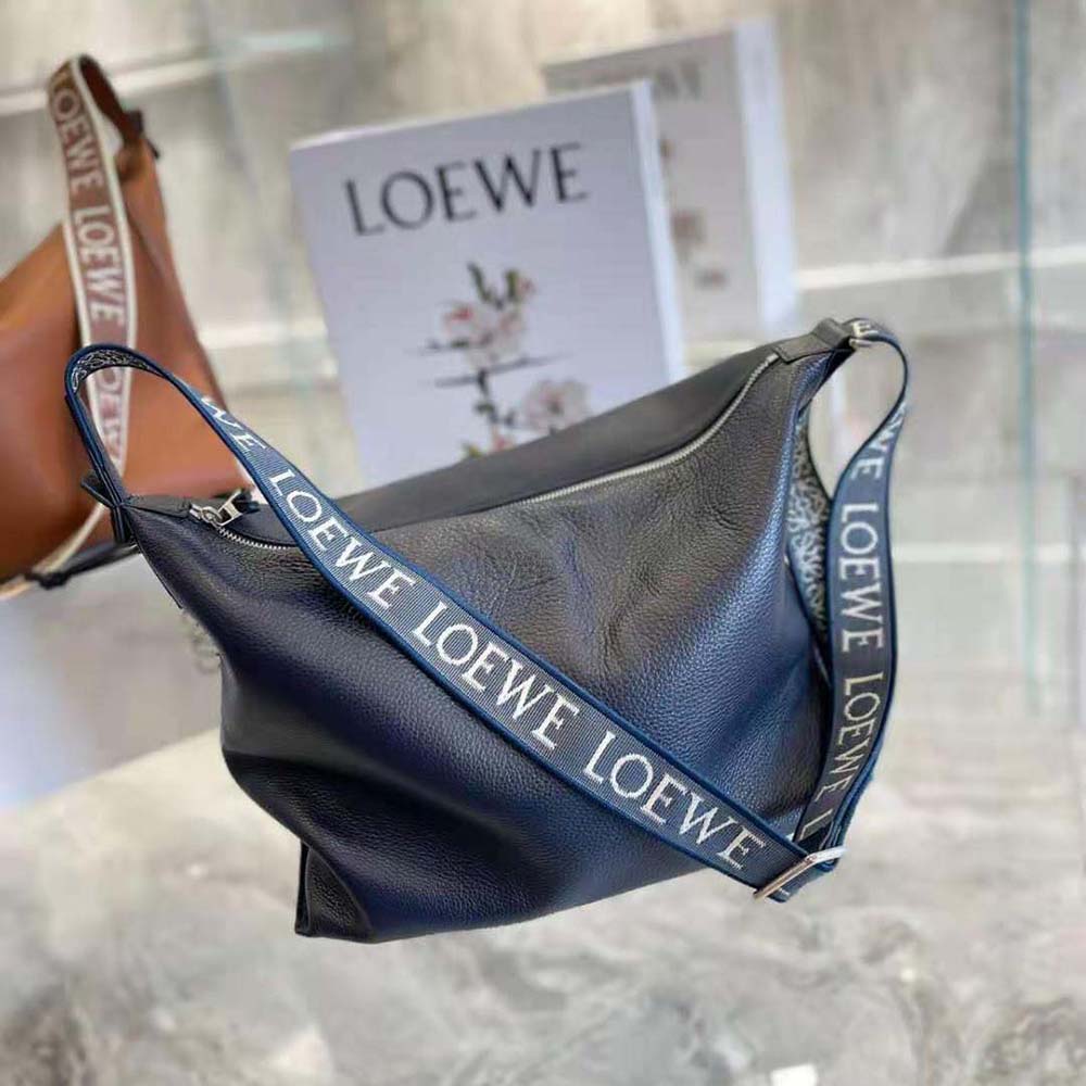 Side angle showing adjustable strap on Loewe Women Cubi Crossbody Bag navy