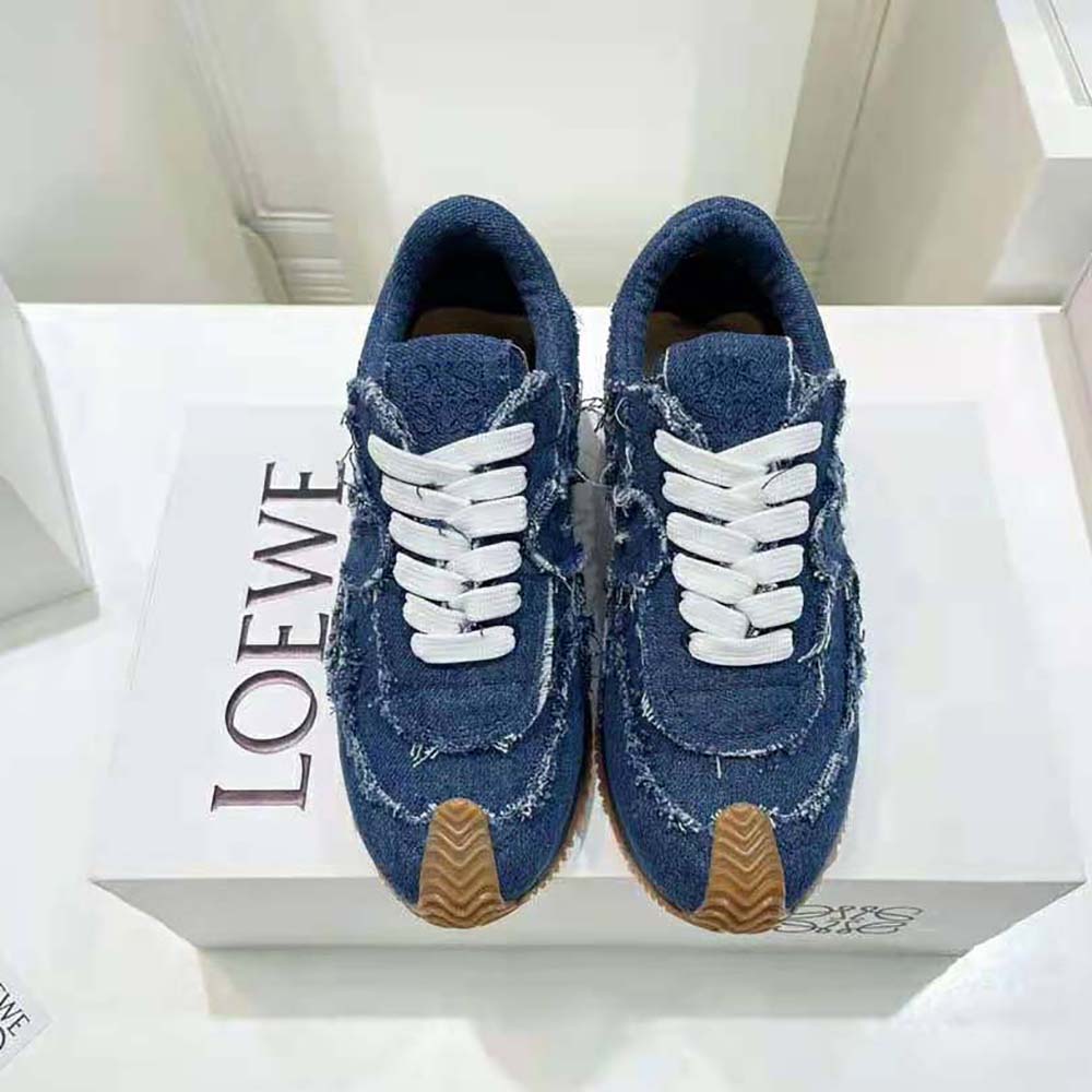 Close-up of denim fabric and rubber sole on Loewe Flow Runner