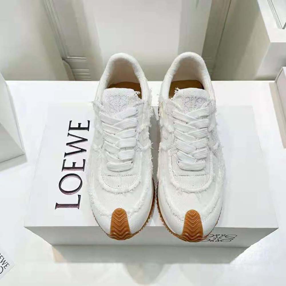 Close-up of denim and white leather texture on Loewe Flow Runner