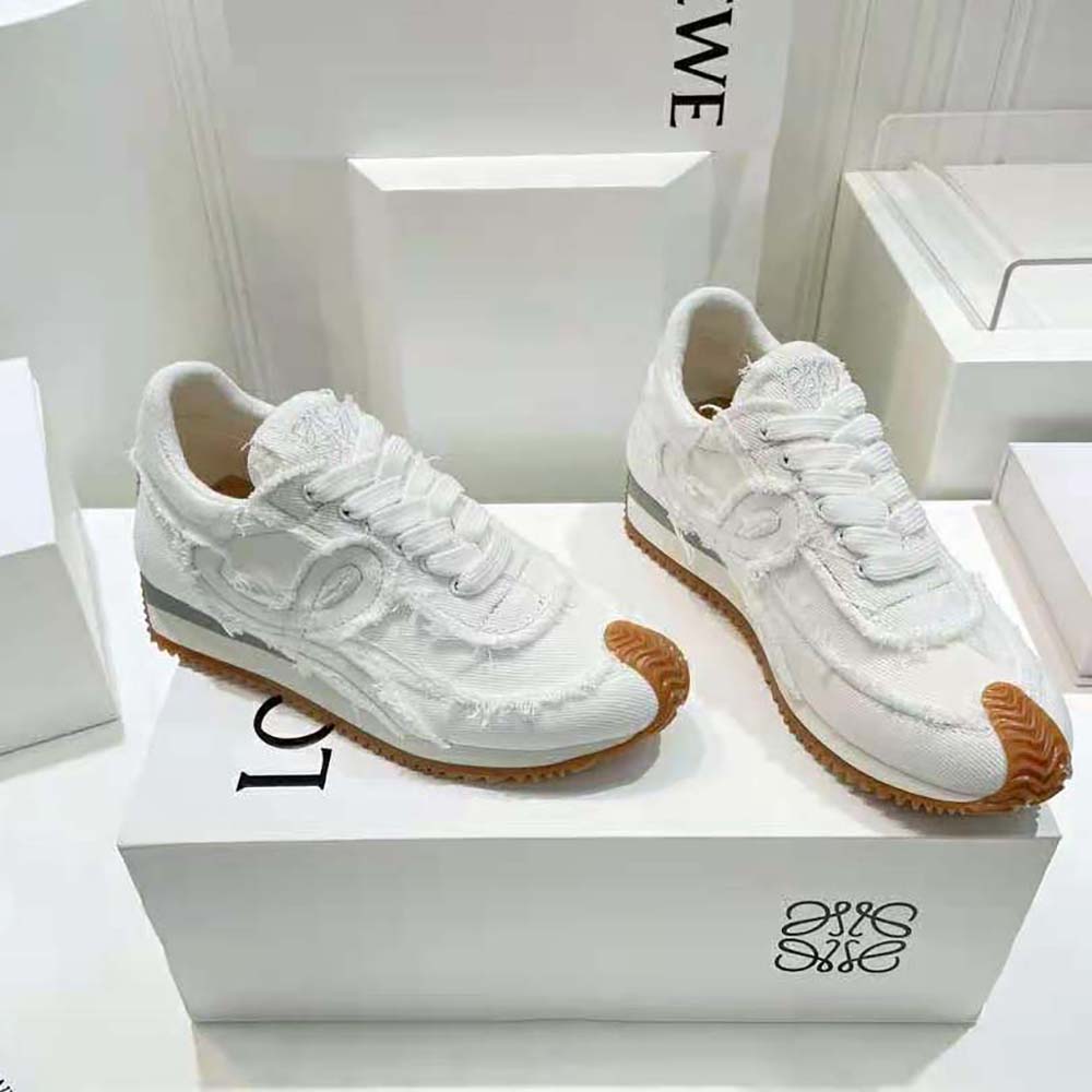 Top-down detail of lace-up and embossed Loewe logo on sneaker
