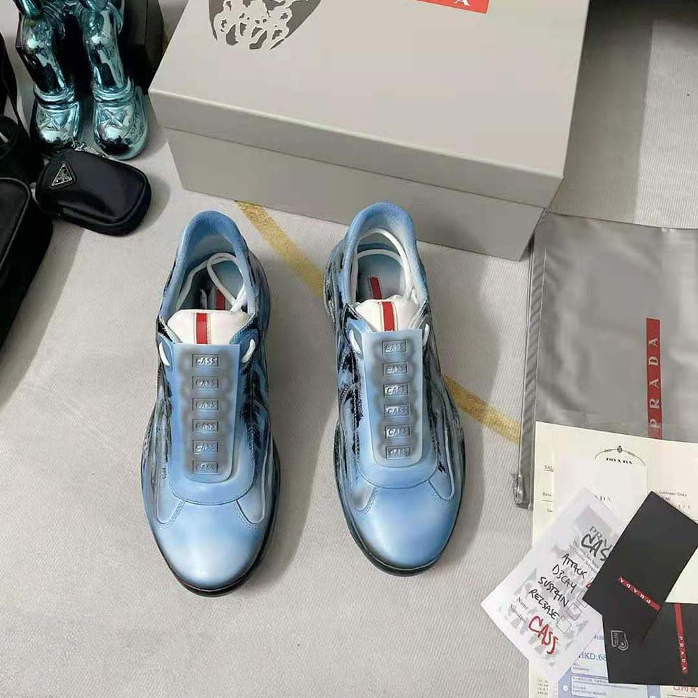Close-up on lace and signature hardware of Prada Unisex Cass x Prada Americas Cup D3cay Sneakers-Blue