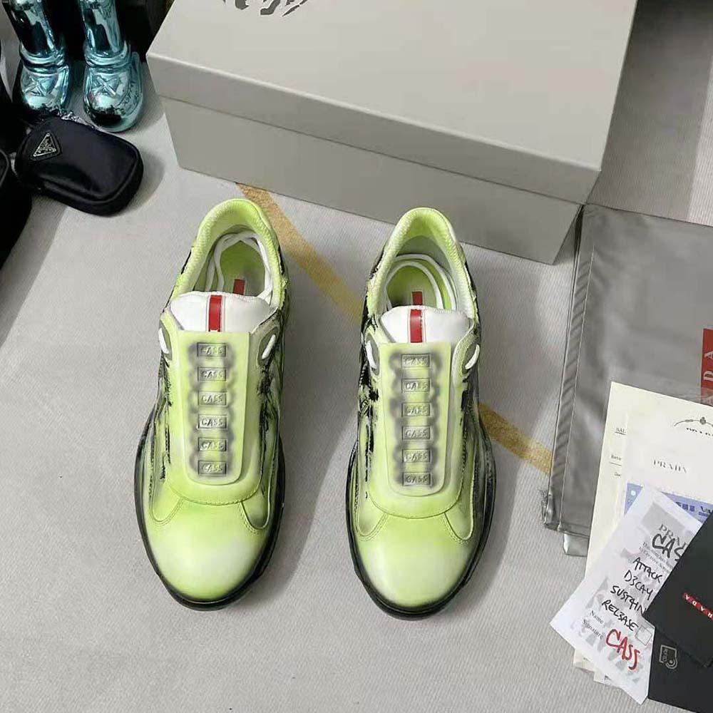 Close-up on green leather and branded hardware of Prada Unisex Cass x Prada Americas Cup D3cay Sneakers-Green