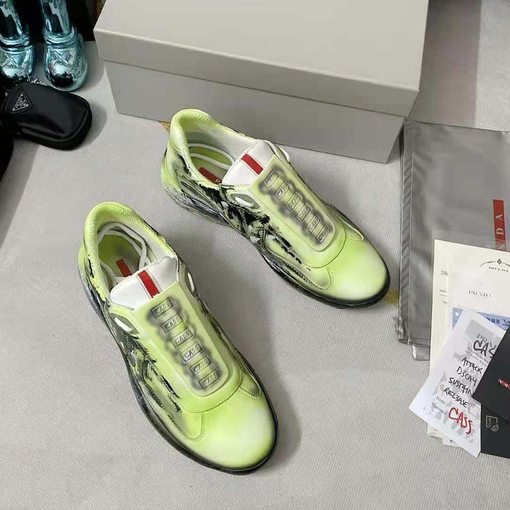 Top angle showing lace-up closure of Prada Unisex Cass x Prada Americas Cup D3cay Sneakers-Green
