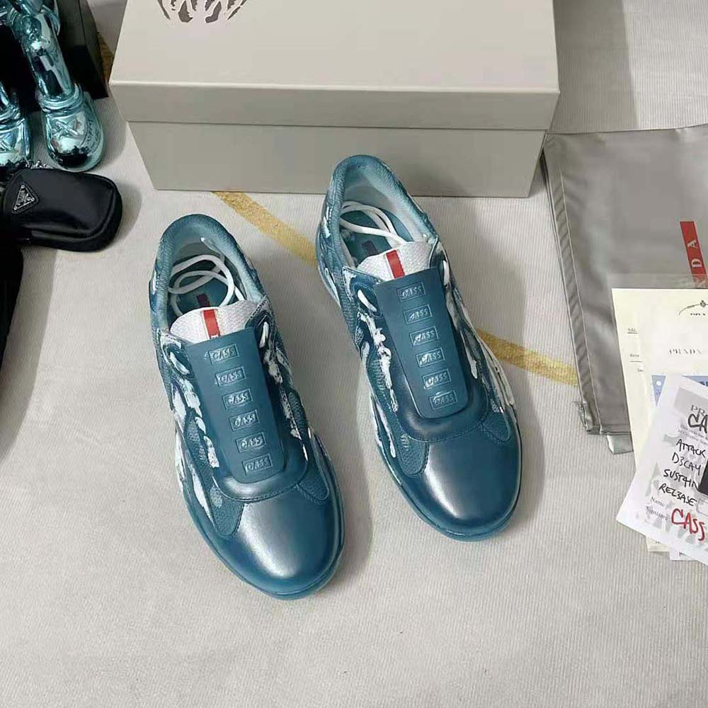 Close-up on navy mesh and signature Prada branding detail