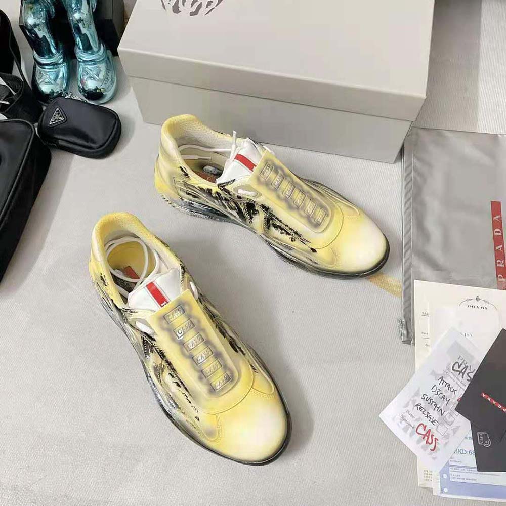 Top view detailing mixed textile and leather on Prada yellow sneakers
