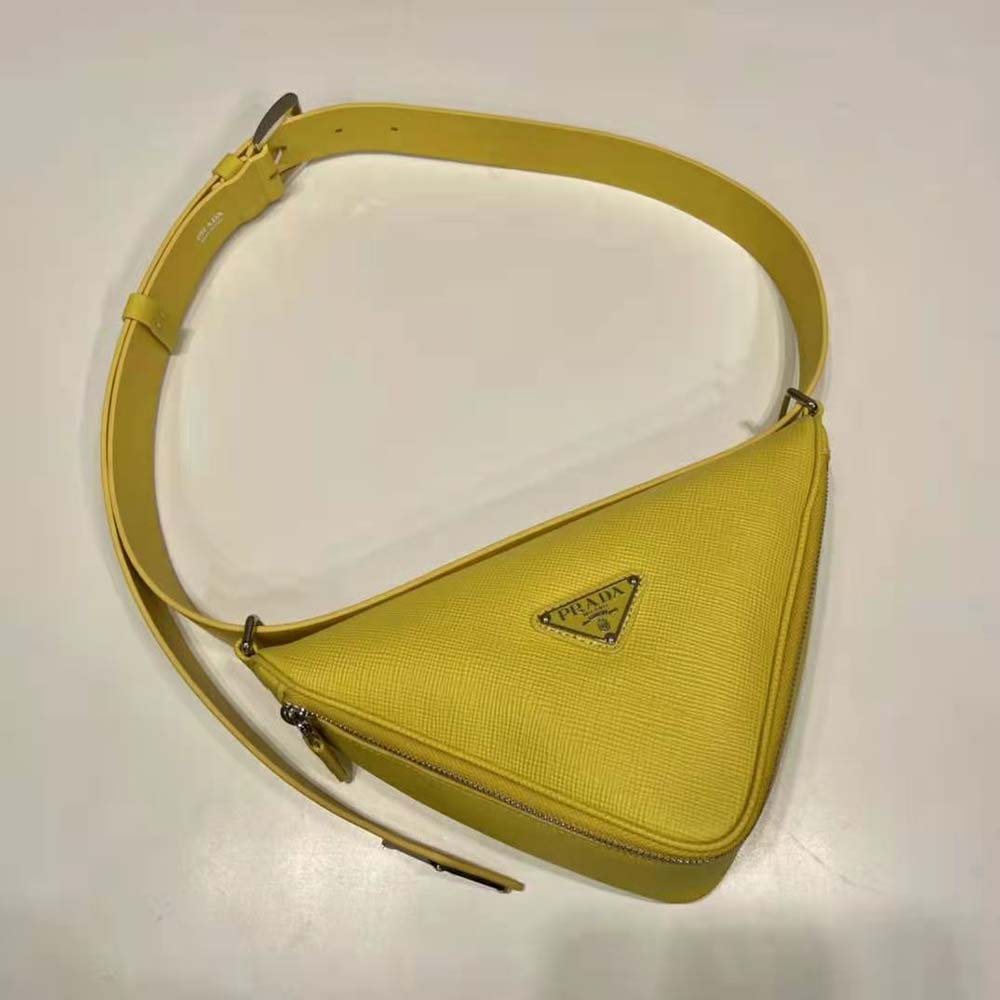 Side angle showing slim profile of Prada Unisex Saffiano Leather Belt Bag-Yellow