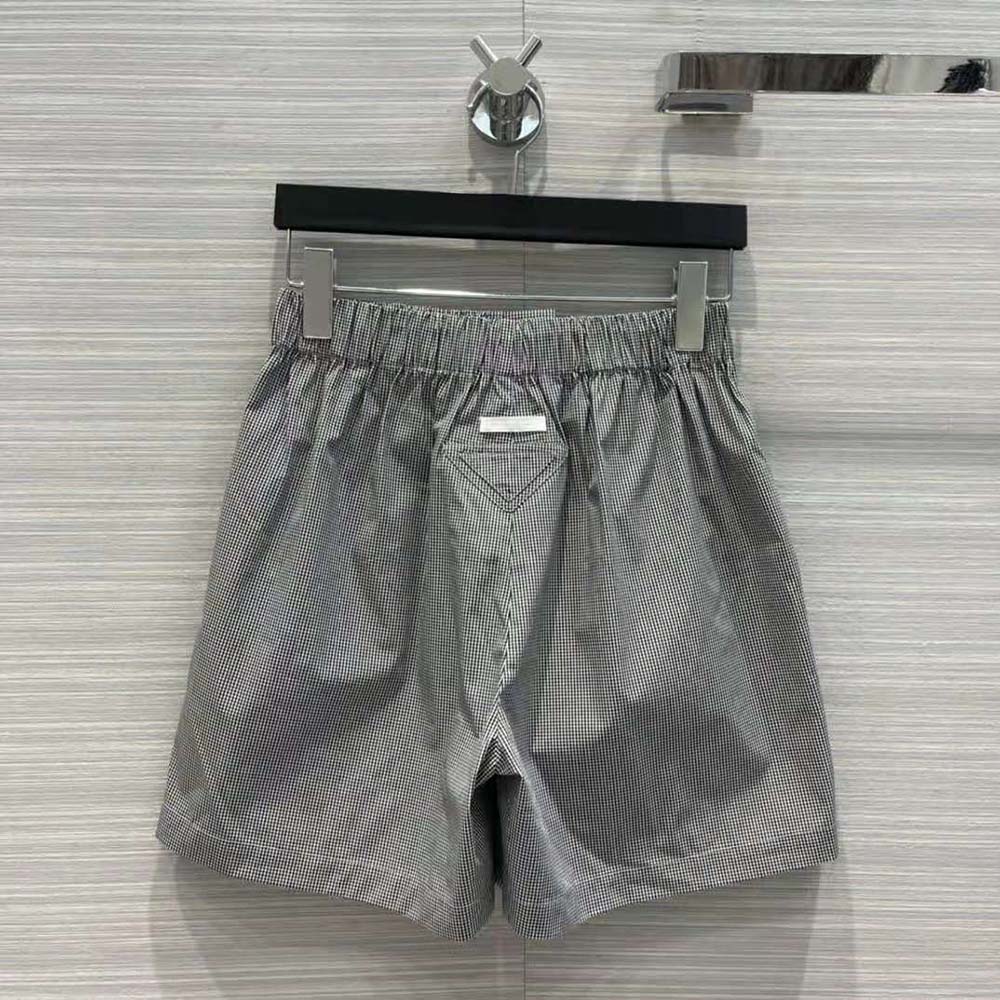 Side angle showing tailored silhouette of Prada Women Gingham Check Shorts