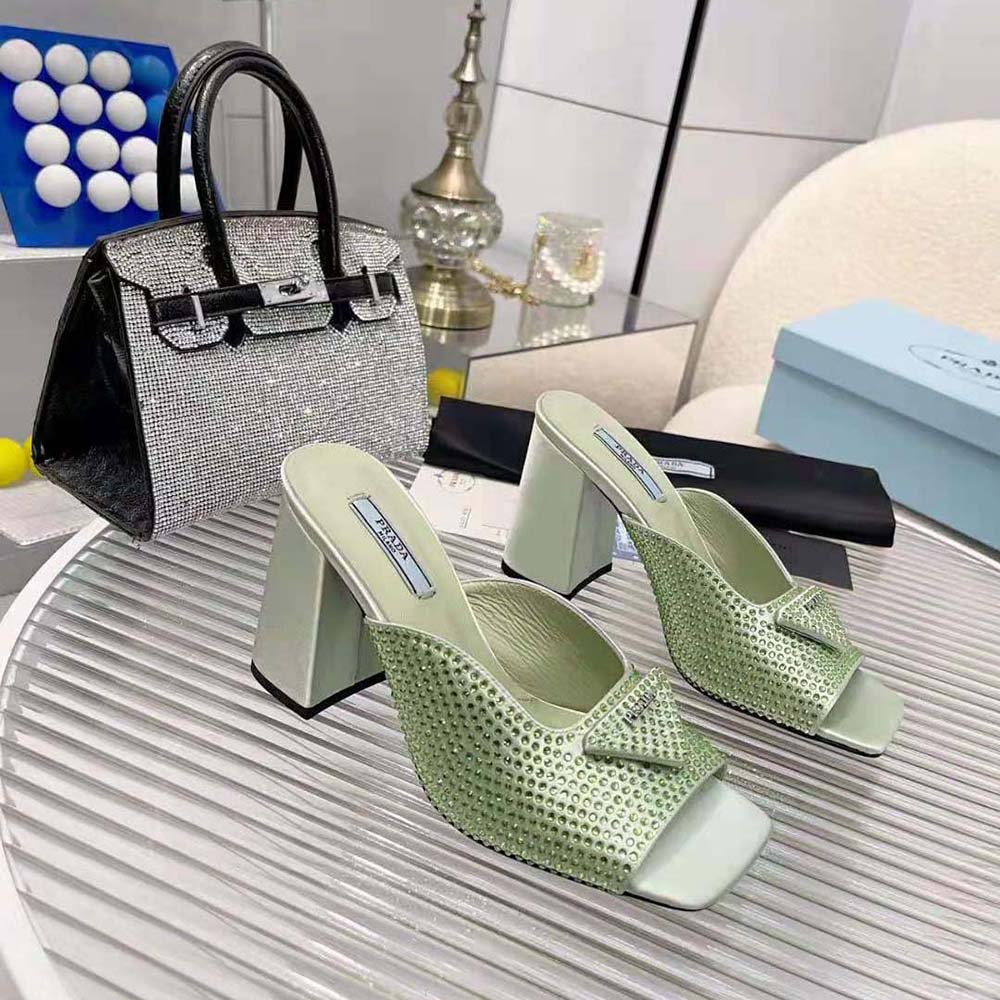 Top angle showing open-toe and satin finish of Prada high-heeled slides