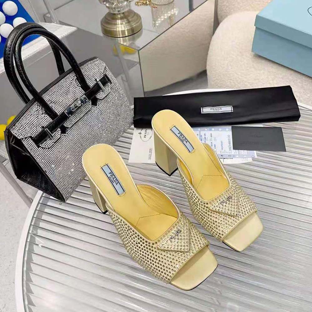 Close-up of crystal embellishments on Prada Women High-Heeled Satin Slides Yellow