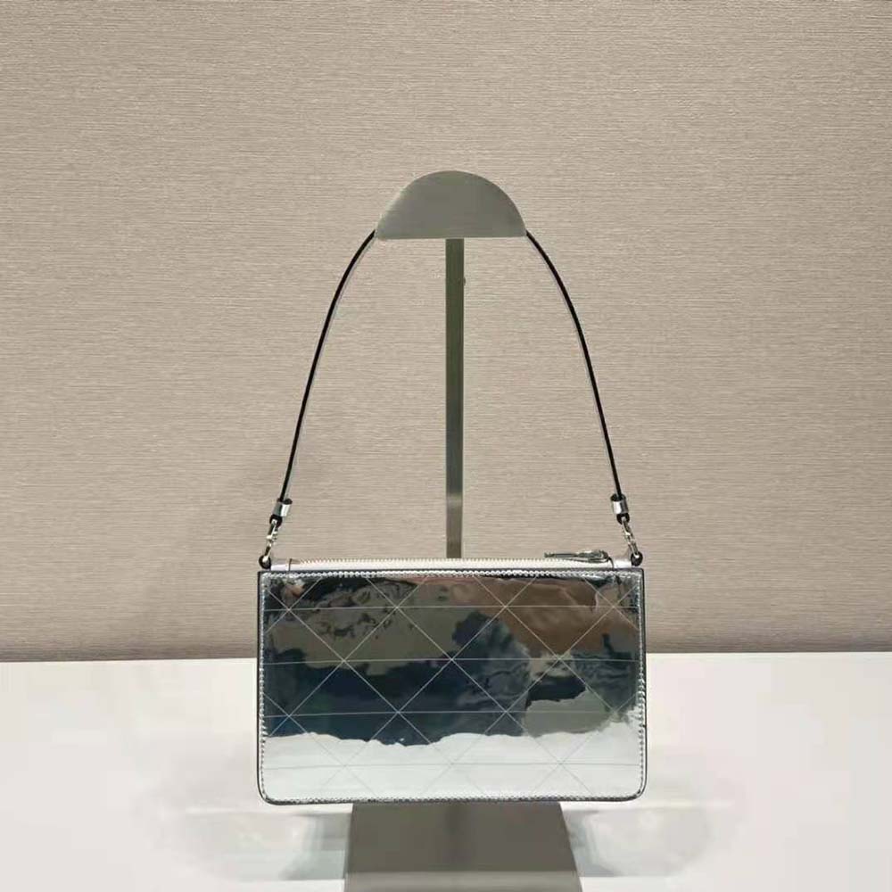 Side angle highlighting compact silhouette of Prada Women Metallic Leather Mini-Bag-Silver