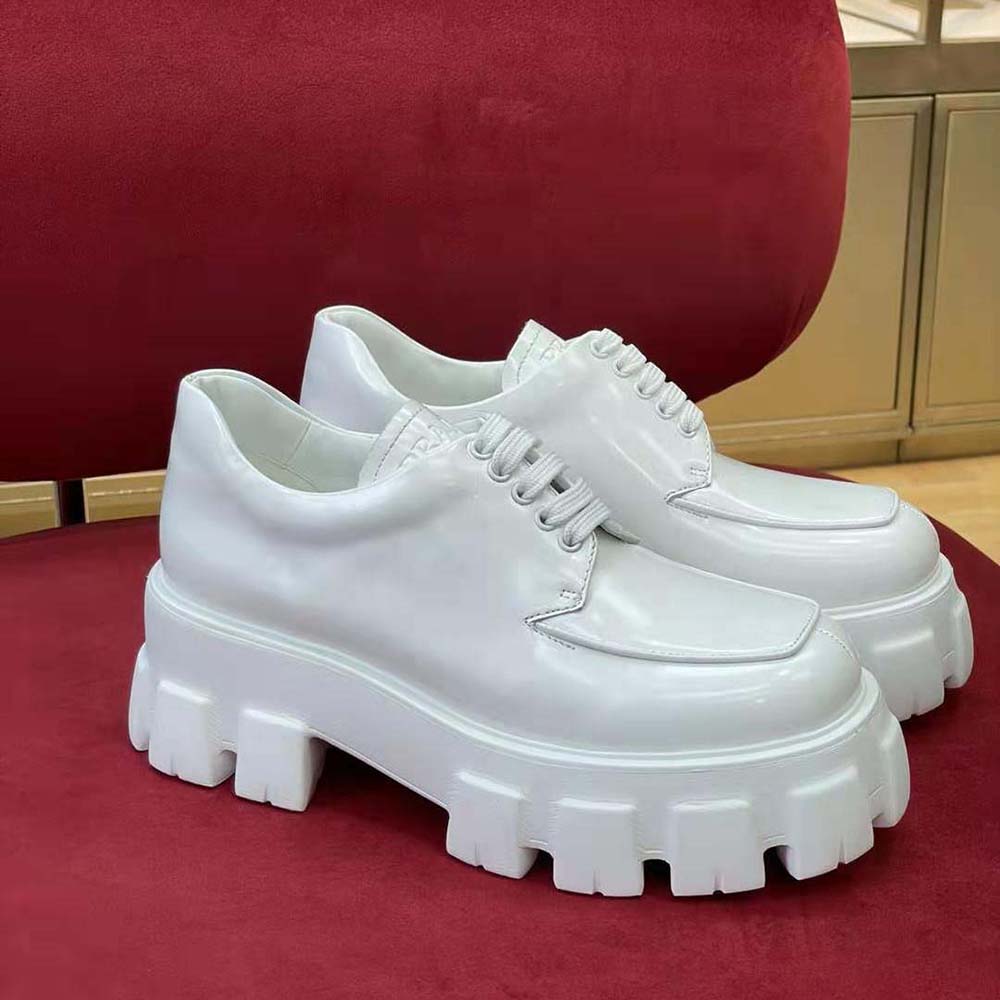 Close-up of white brushed leather texture and lace-up detail