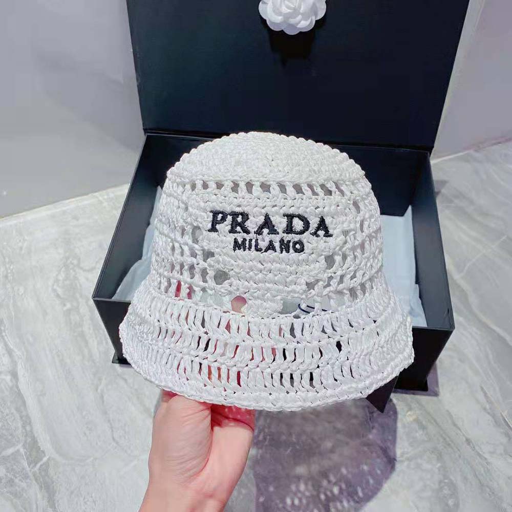 Close-up of woven raffia texture and Prada logo hardware detail