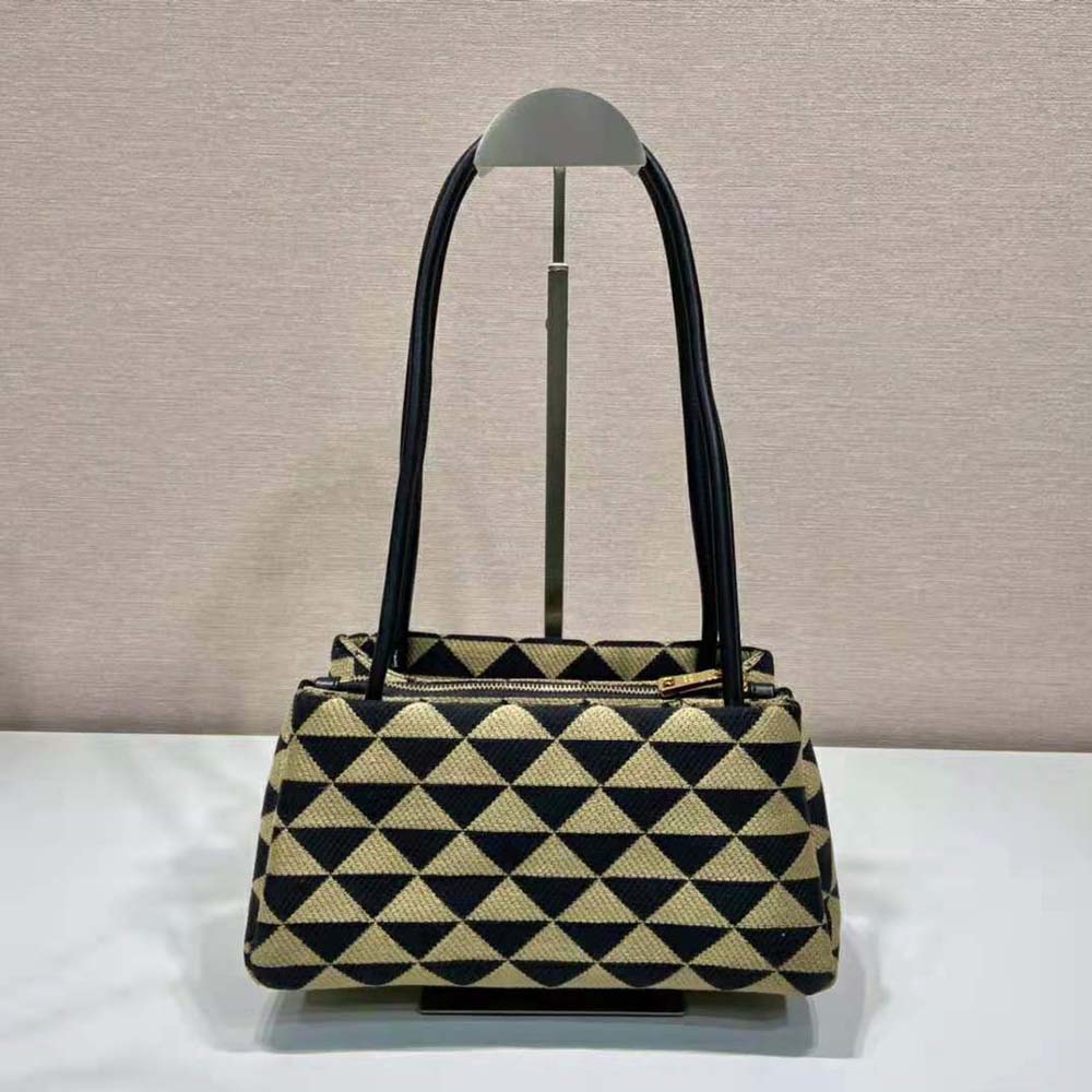 Side angle showing compact silhouette of Prada Women Small Embroidered Fabric Bag-Brown