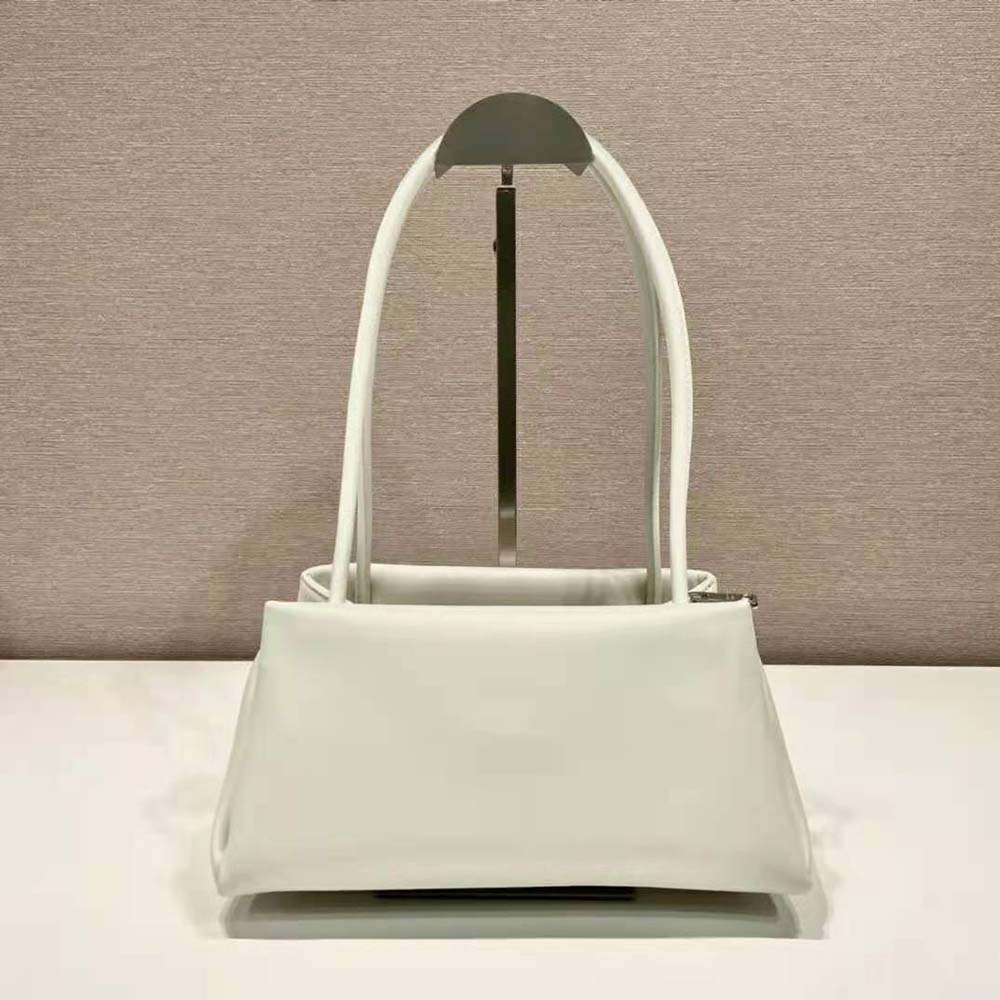 Side angle showing structured silhouette of Prada Women Small Leather Bag-White