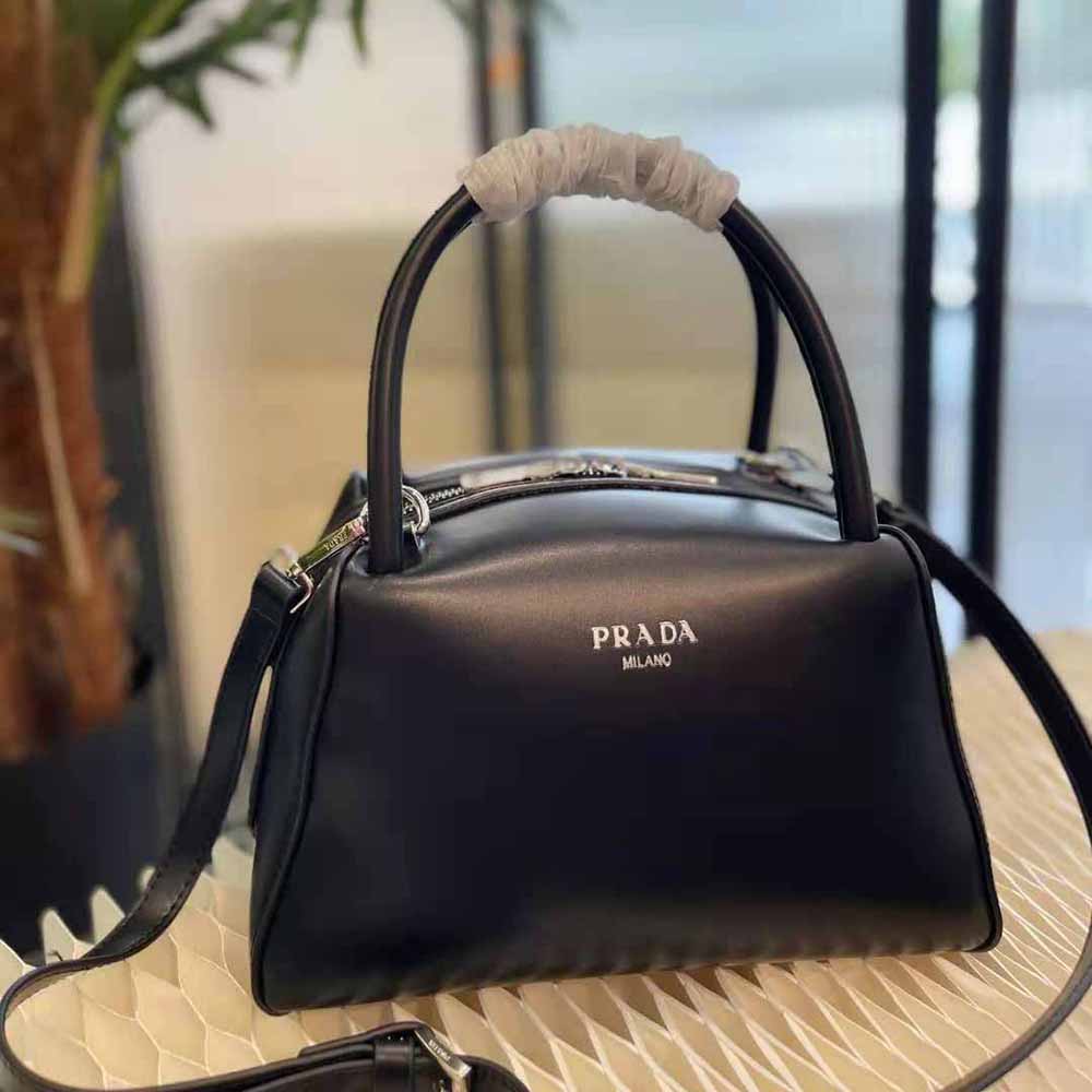 Close-up of gold-tone hardware on Prada Women Small Leather Handbag-Black