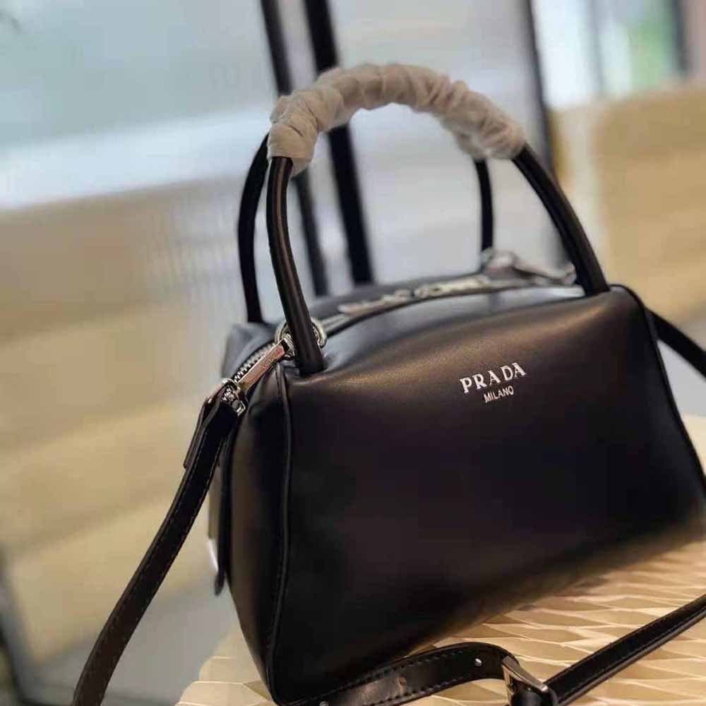 Side profile of Prada Women Small Leather Handbag-Black highlighting silhouette