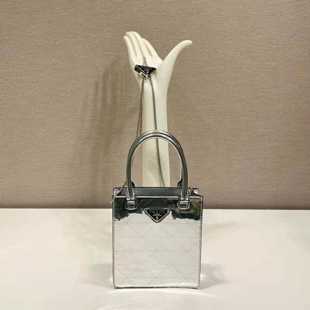 Close-up of silver metallic leather texture on Prada tote bag