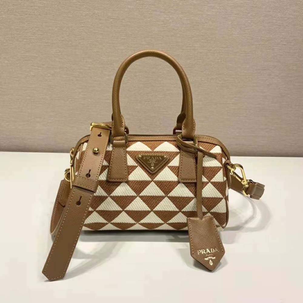 Side view showing compact silhouette of Prada Women Symbole Top-Handle Bag