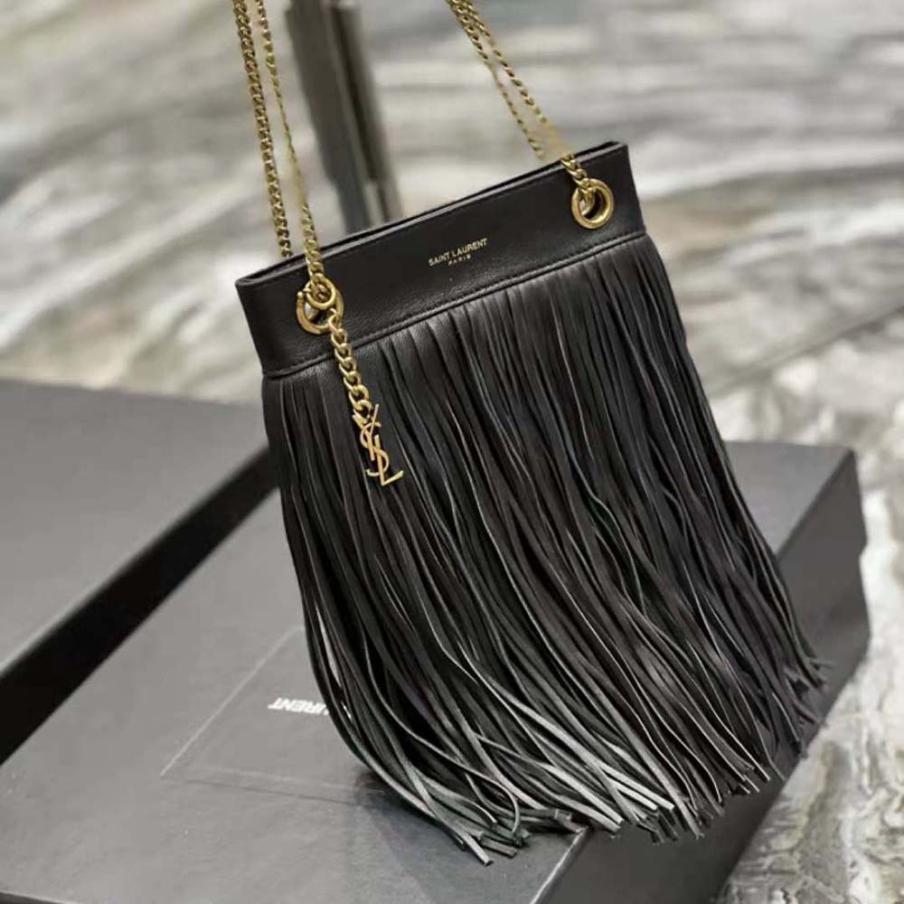 Side angle showing compact silhouette and suede texture of YSL Women Grace Bag