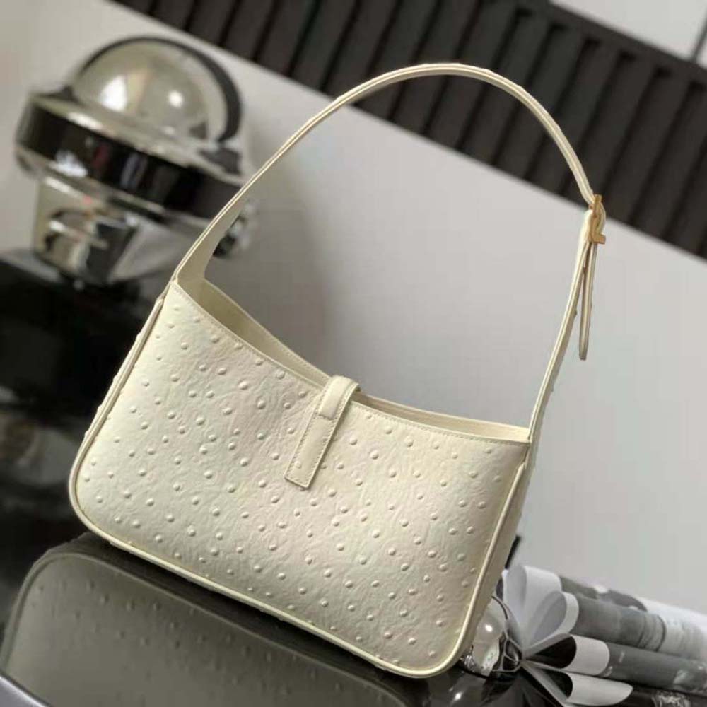 Side angle showing soft silhouette of Saint Laurent YSL Ostrich-White hobo bag
