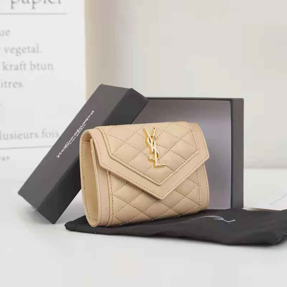 Close-up of gold-tone Vlogo detail on Saint Laurent YSL cardholder in sandy leather