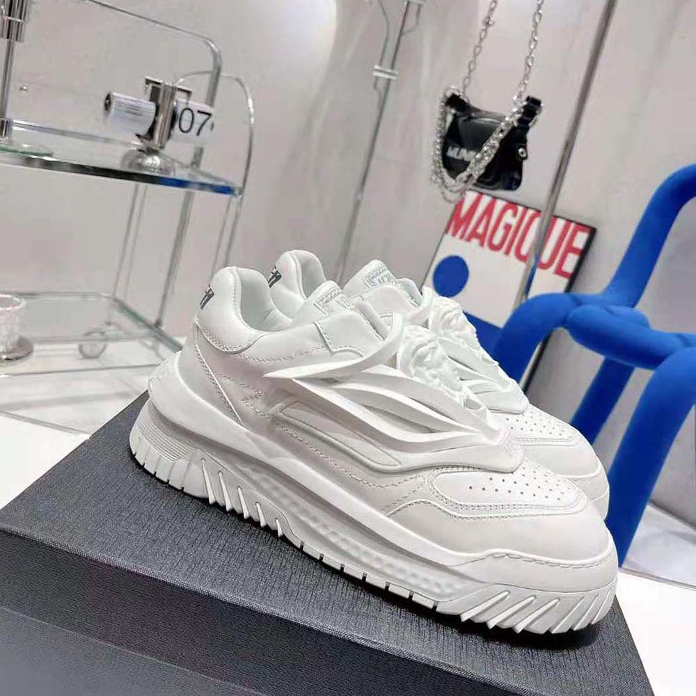 Top angle of white Versace Unisex Odissea Sneakers highlighting leather texture