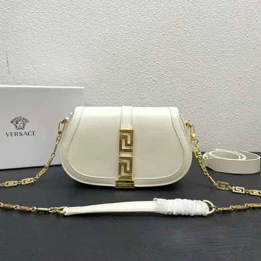 Close-up of gold Greca motif on Versace Women Greca Goddess Shoulder Bag-White