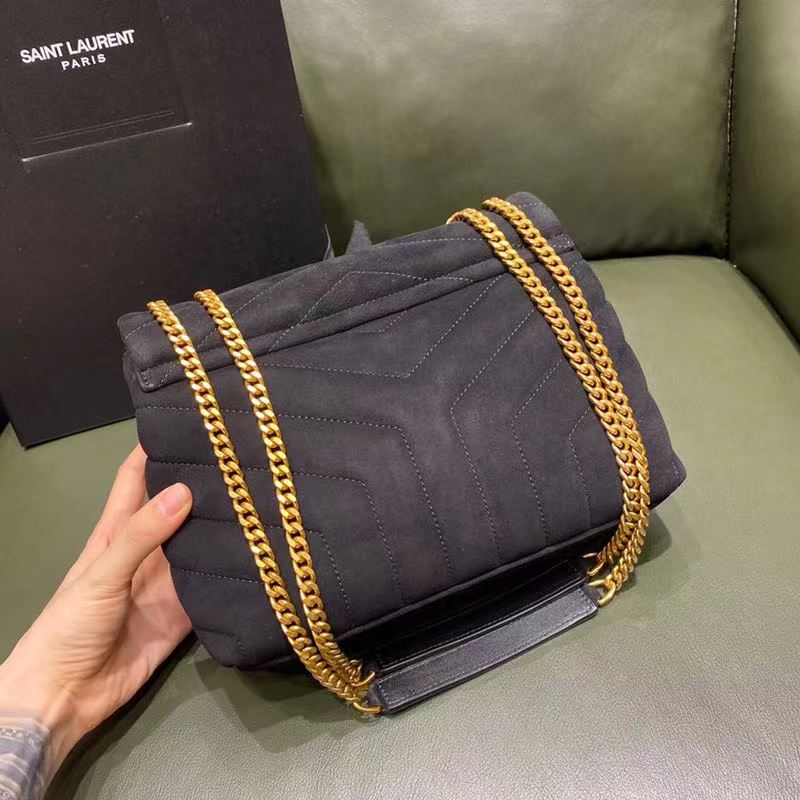 Side angle showing smooth leather and suede contrast on YSL bag