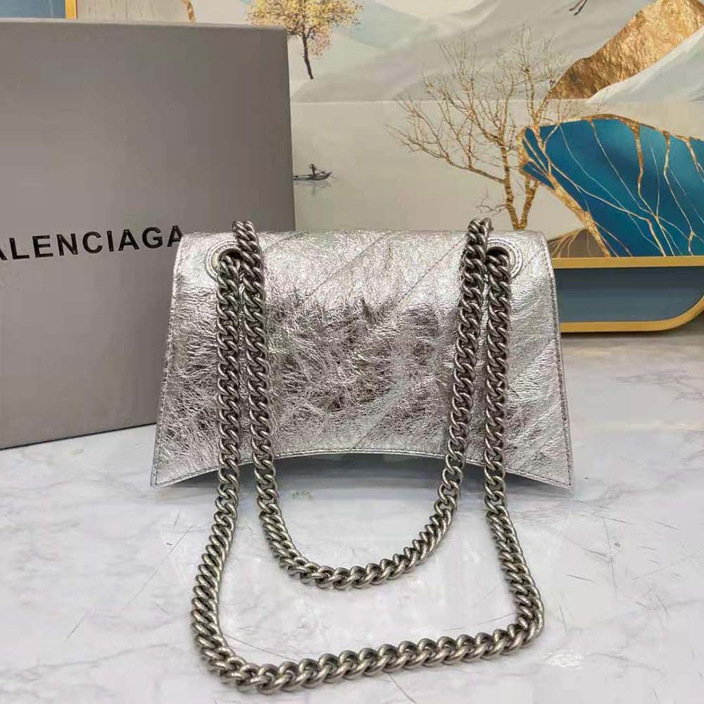 Side angle showing compact silhouette of Balenciaga Women Crush Small Chain Bag