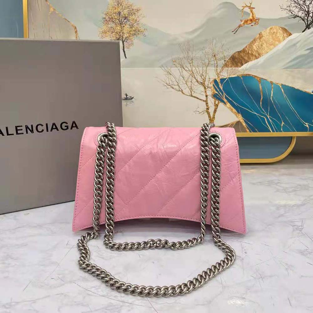 Side angle showing compact silhouette of Balenciaga Chain Bag in pink