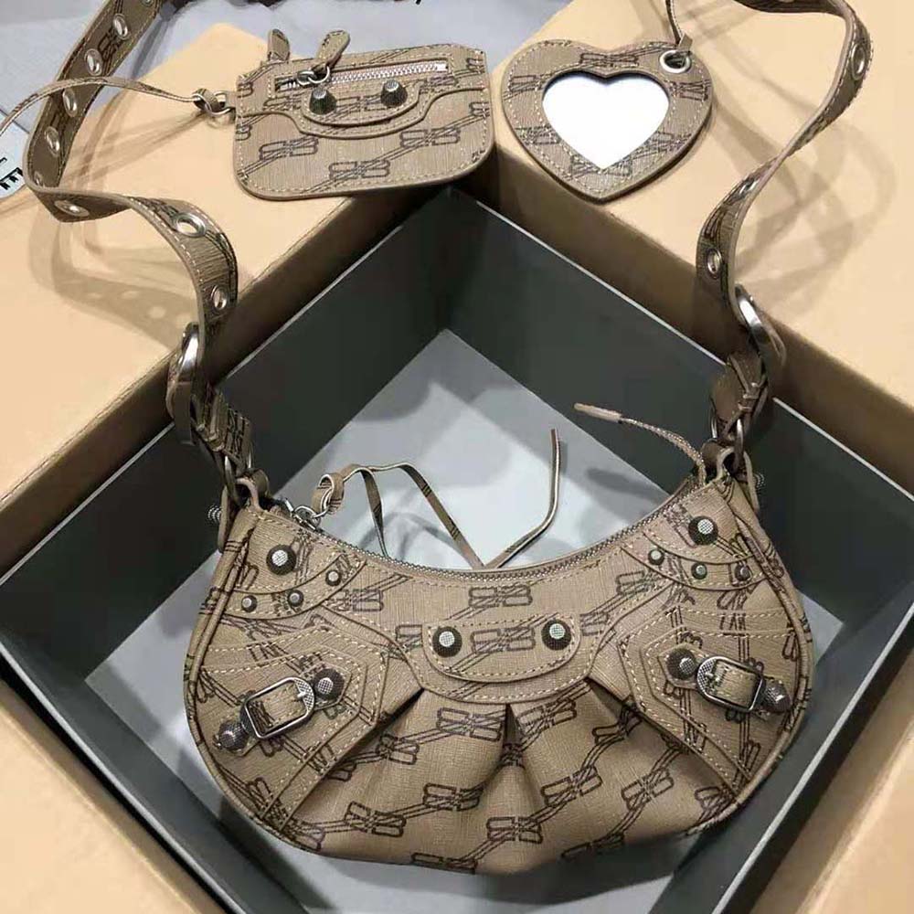 Close-up of chain strap and BB monogram on Balenciaga Women Le Cagole Mini Bag