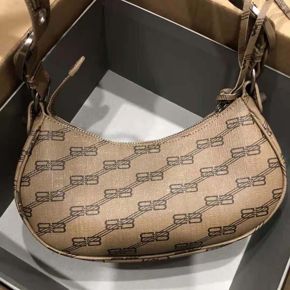 Side angle showing coated canvas texture of Balenciaga Women Le Cagole Mini Bag