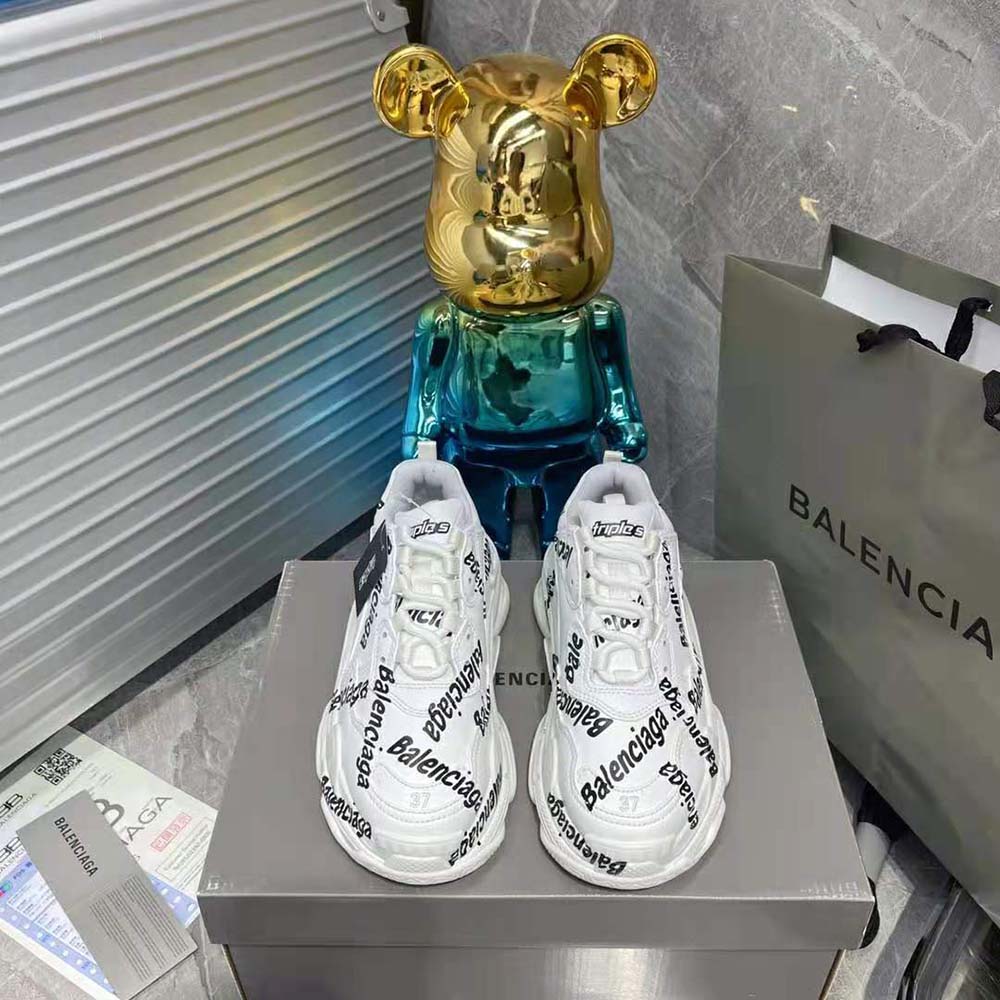 Close-up of Balenciaga logotype detail on Triple S sneaker upper