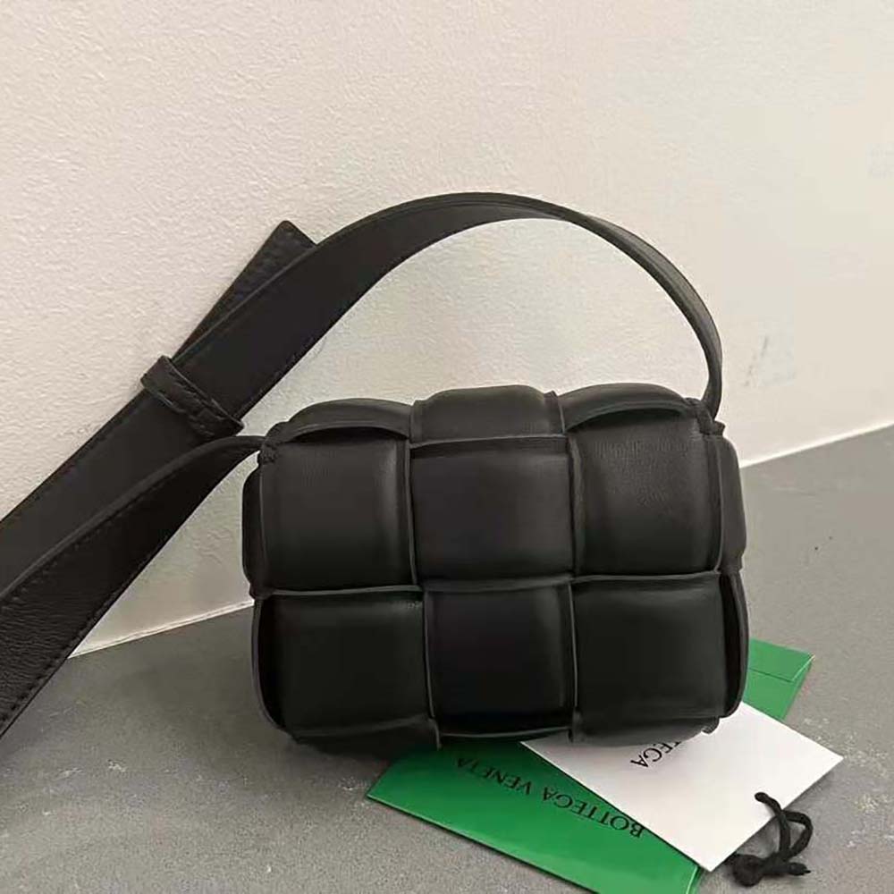 Side angle showing gold-tone hardware and padded silhouette of Bottega Veneta Candy bag