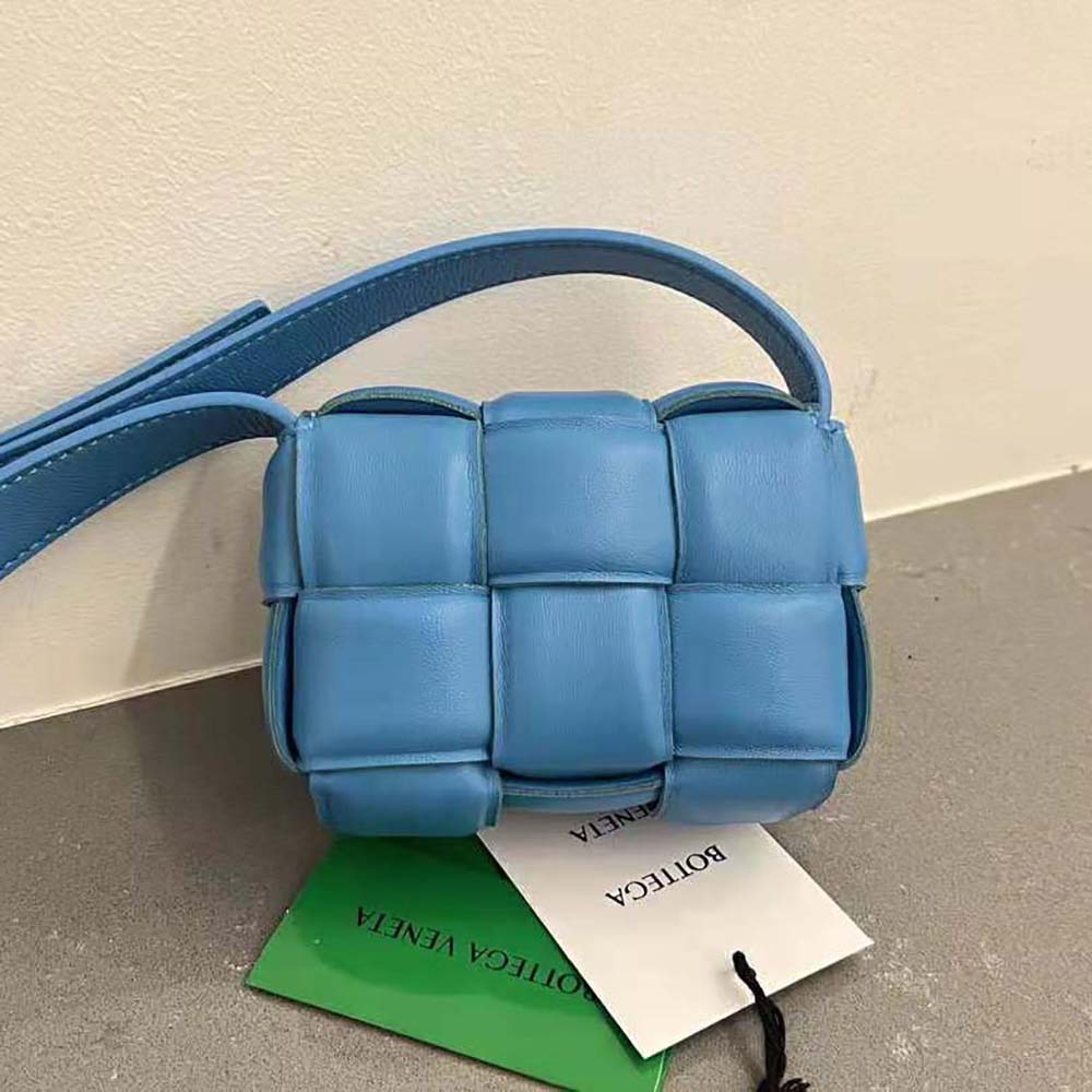 Side angle showing gold-tone hardware on Bottega Veneta Candy Padded Cassette Mini bag