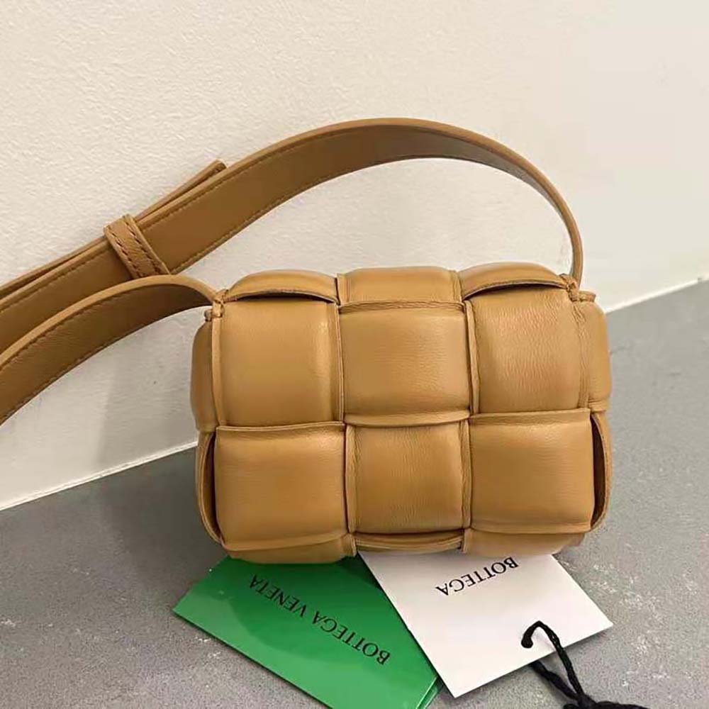 Side angle showing adjustable strap and compact silhouette of Bottega Veneta cross-body bag