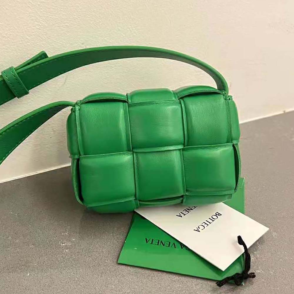 Side angle showing padded texture and adjustable strap on Bottega Veneta cross-body
