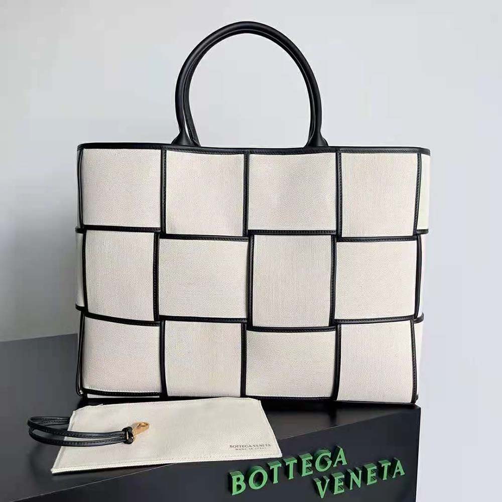 Close-up of black intrecciato leather detail on tote bag