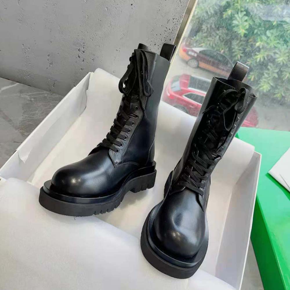 Close-up on lace-up closure and stitching of Bottega Veneta boot