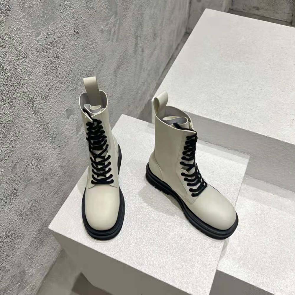Top-down shot showing lug sole and lace-up detail of Bottega Veneta white boot