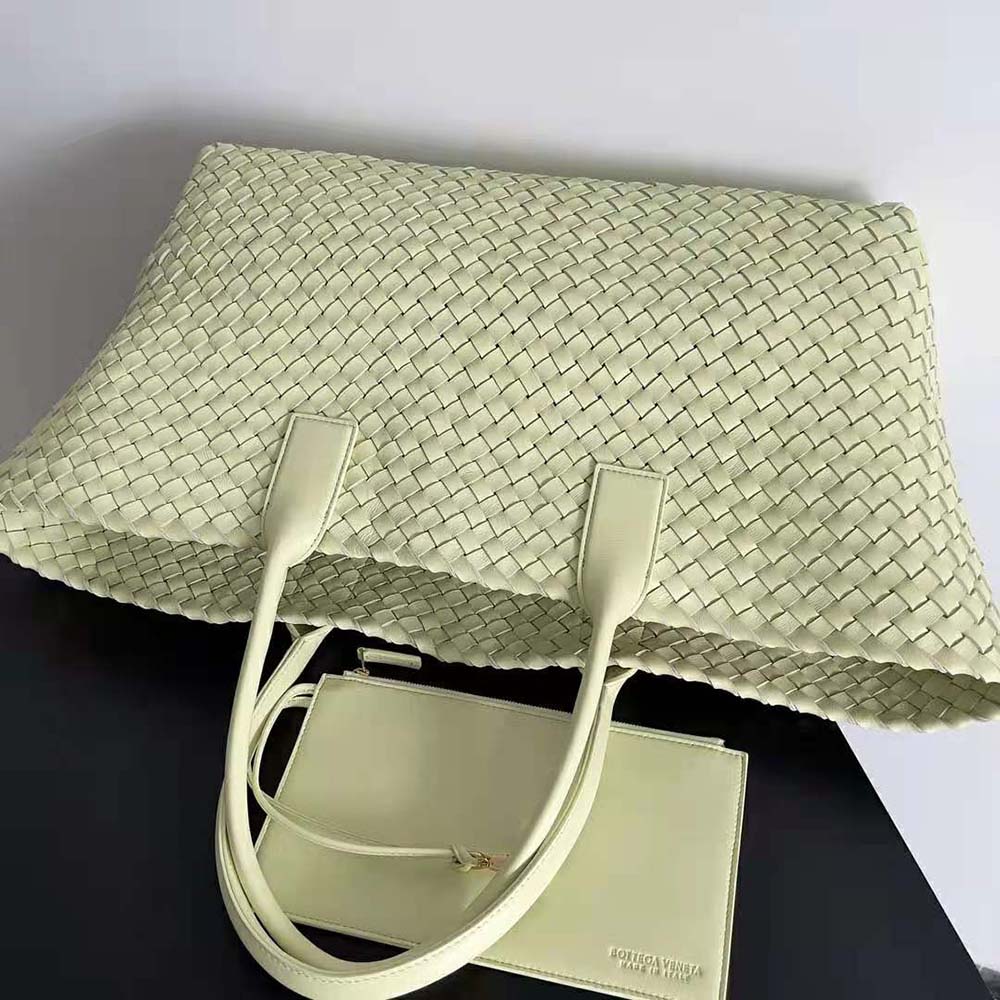 Side angle showing silver-tone hardware on Bottega Veneta Cabat Tote Lime
