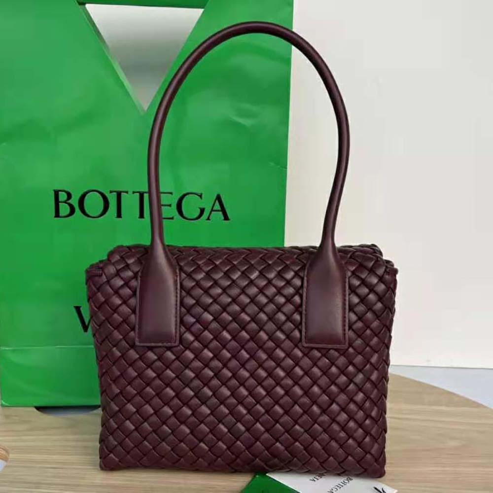 Top handle detail on Bottega Veneta Women Patti Top Handle Bag in maroon lambskin