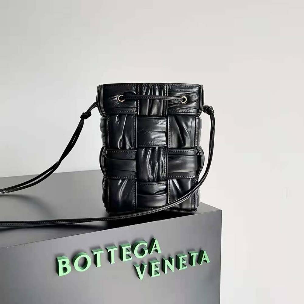 Close-up of black lambskin leather and intrecciato weave on Bottega Veneta bag