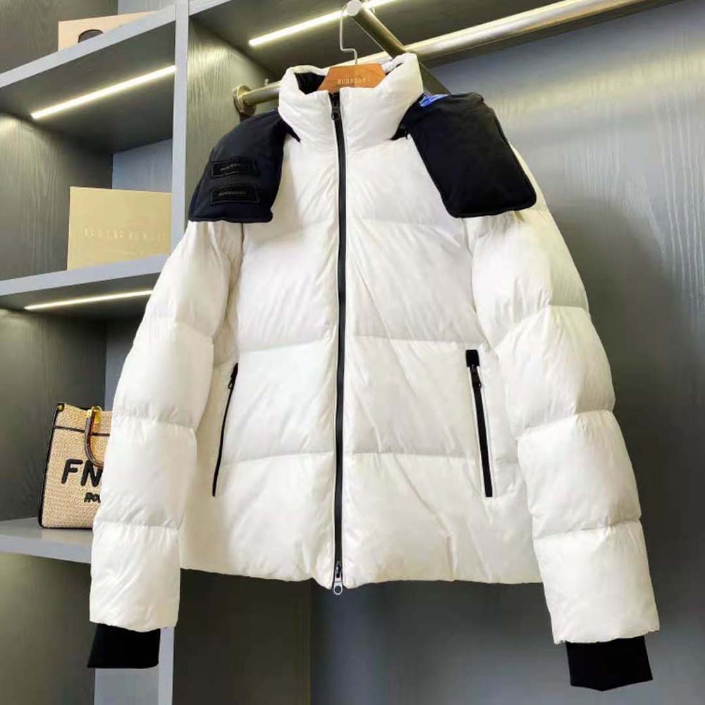 Close-up of zipper and branded hardware on Burberry Women Detachable Hood Nylon Puffer Jacket-White