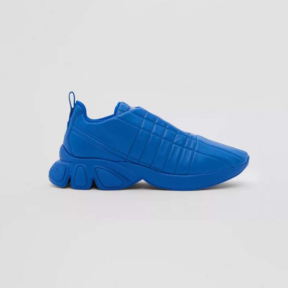 Side profile of Burberry Unisex Quilted Leather Classic Sneakers-Blue showing quilted detail