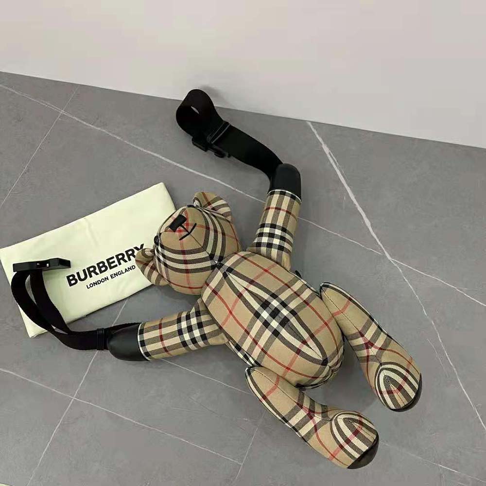 Side angle showing zipper and adjustable strap on Burberry bum bag